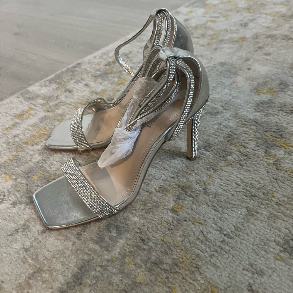 Never been worn heels. Comfy with rhinestone accent